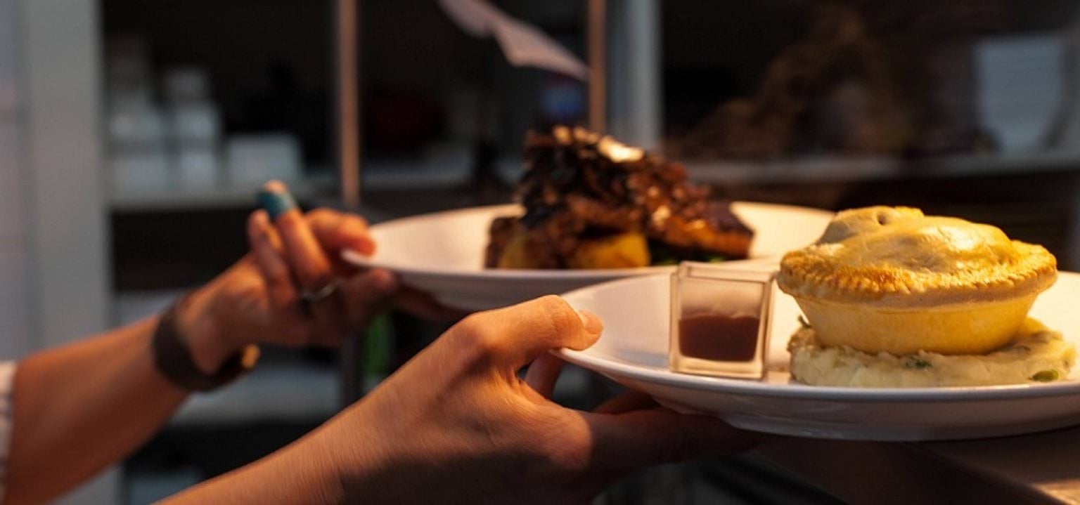 Image of a man holding a food plate