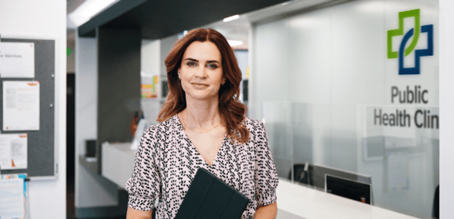 Image of a lady standing inside a clinic
