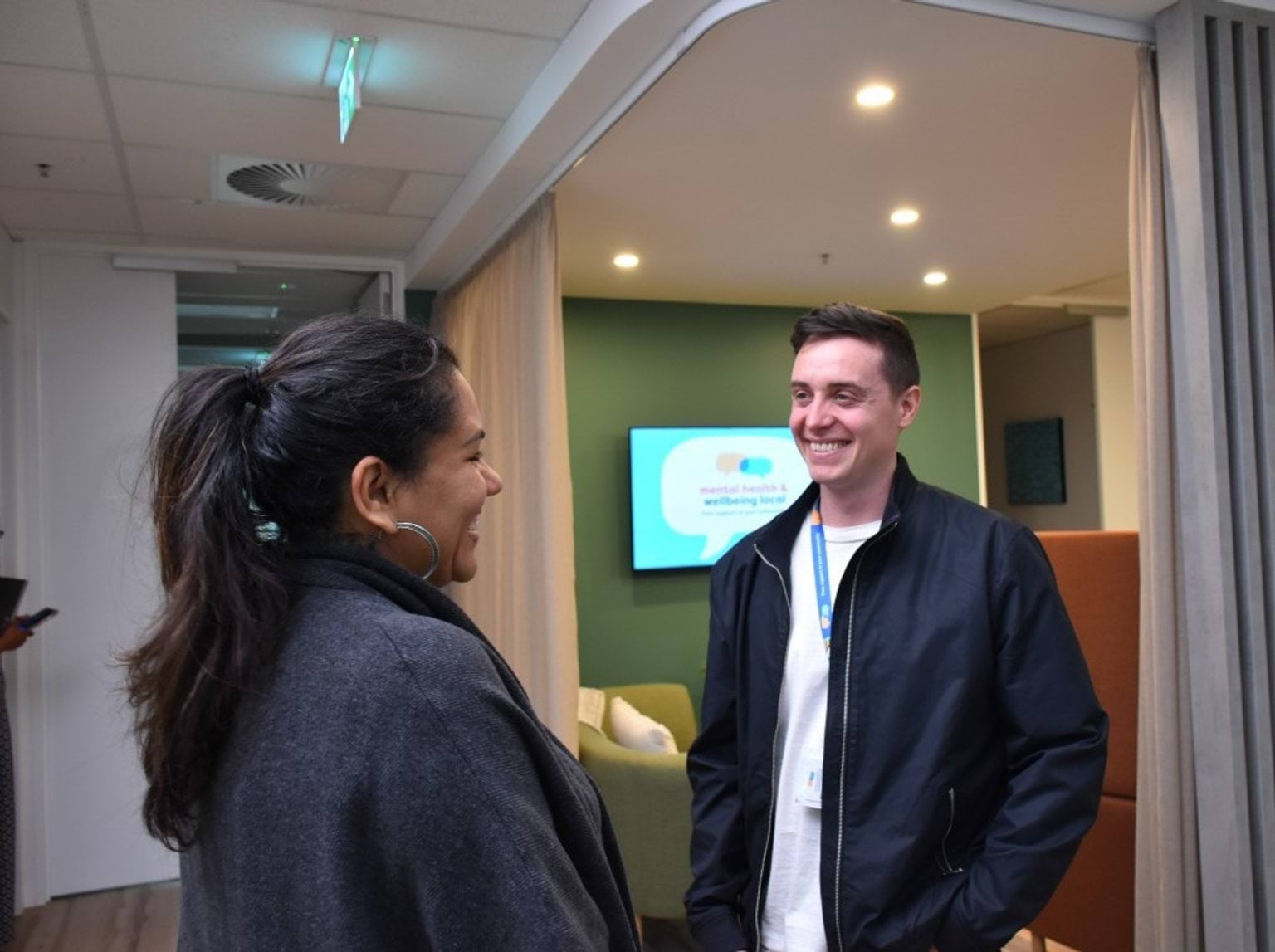 Lived and living experience Two people chatting. At least one is a healthcare professional